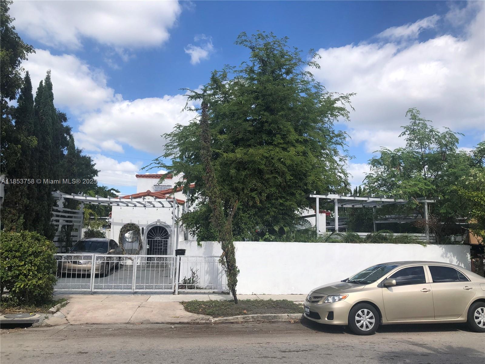 1619 Southwest 13th Street Miami, FL 33145 - Photo 46 of 46 a view of a car parked in front of a house