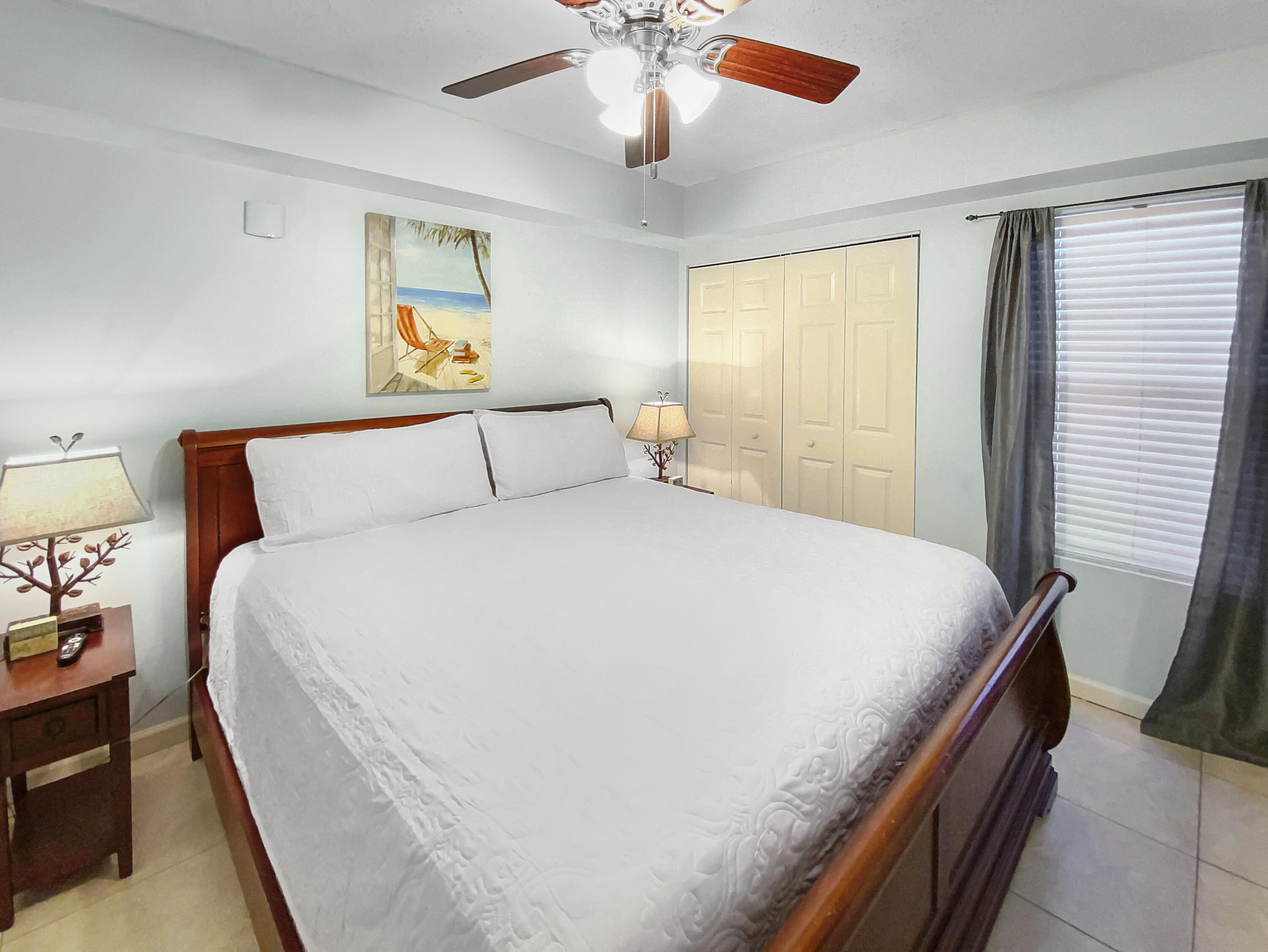 970 Highway 98, Unit 206 Destin, FL 32541 - Photo 13 of 25 a bedroom with a bed and window