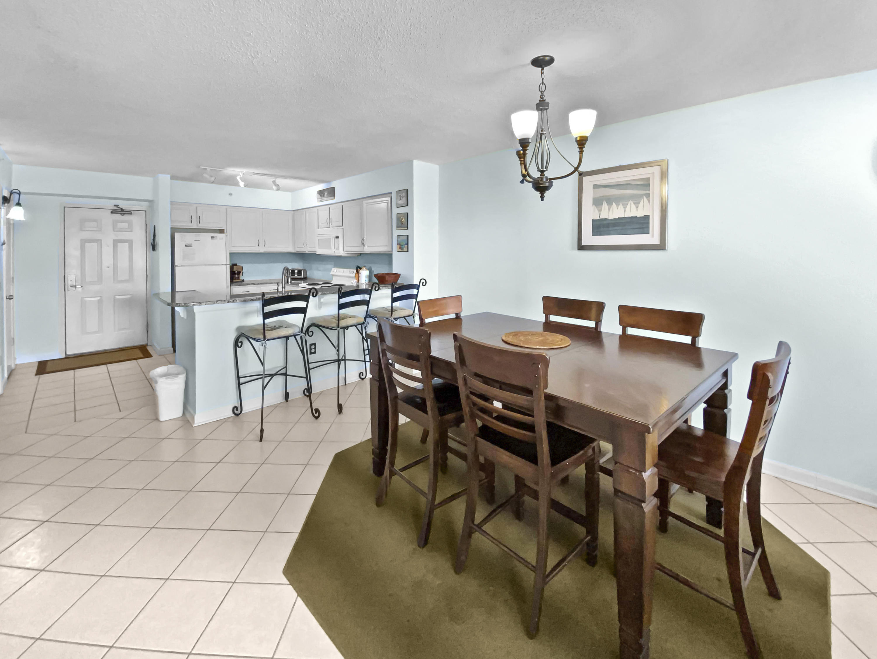 970 Highway 98, Unit 206 Destin, FL 32541 - Photo 2 of 25 a view of a dining room with furniture