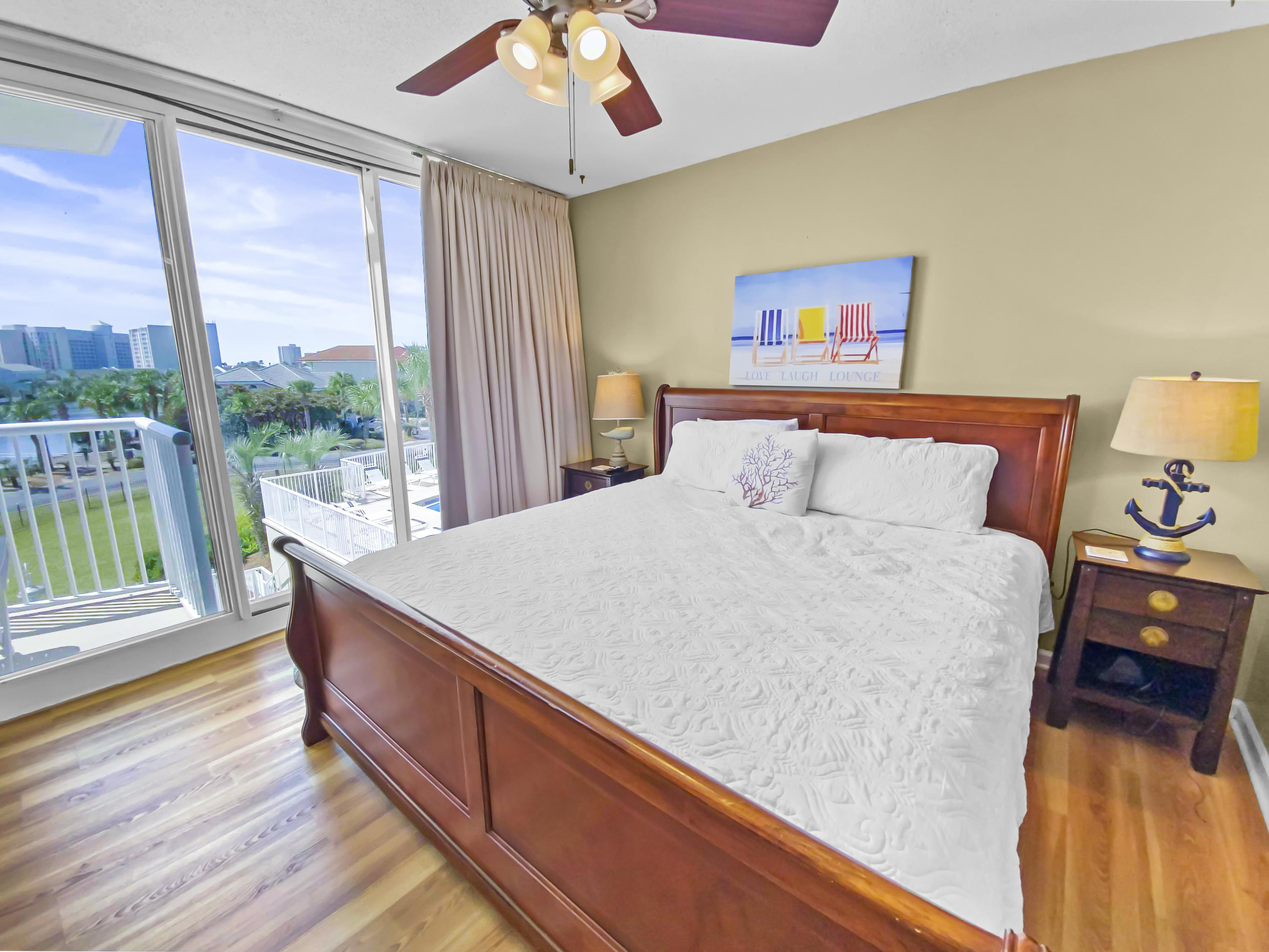 970 Highway 98, Unit 206 Destin, FL 32541 - Photo 9 of 25 a bed sitting in a bedroom next to a window