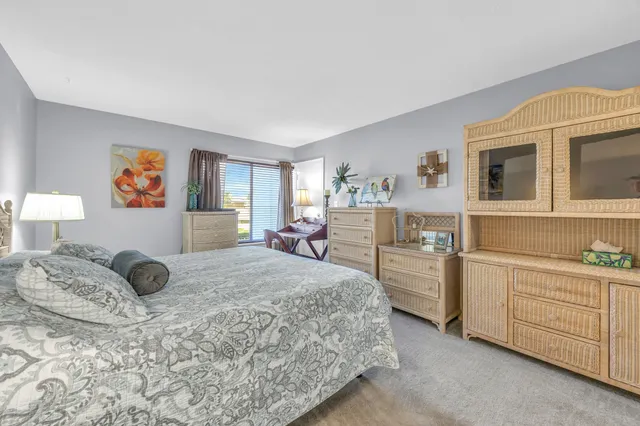 a bedroom with a bed and a cabinets