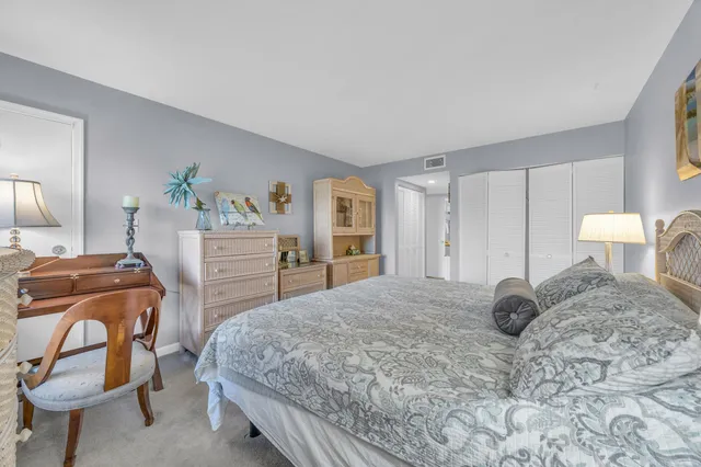 a bedroom with a bed and a chair