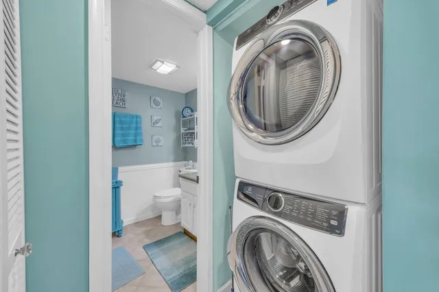 a view of a hallway with washer and dryer