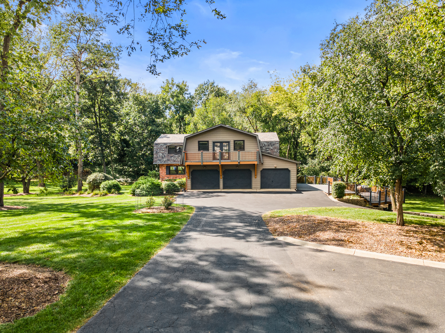 906 Bridle Lane Cary, IL 60013 - Photo 12 of 61 a front view of a house with a garden