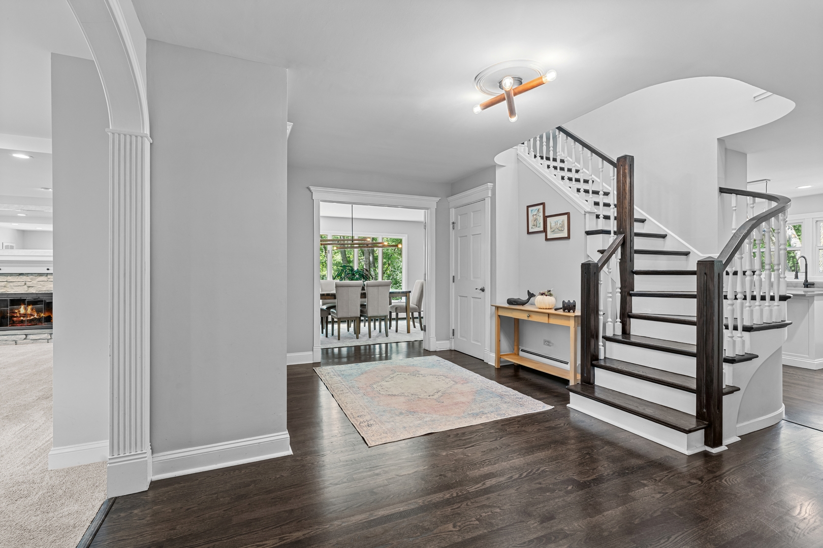 906 Bridle Lane Cary, IL 60013 - Photo 14 of 61 a view of an empty room with stairs and a window