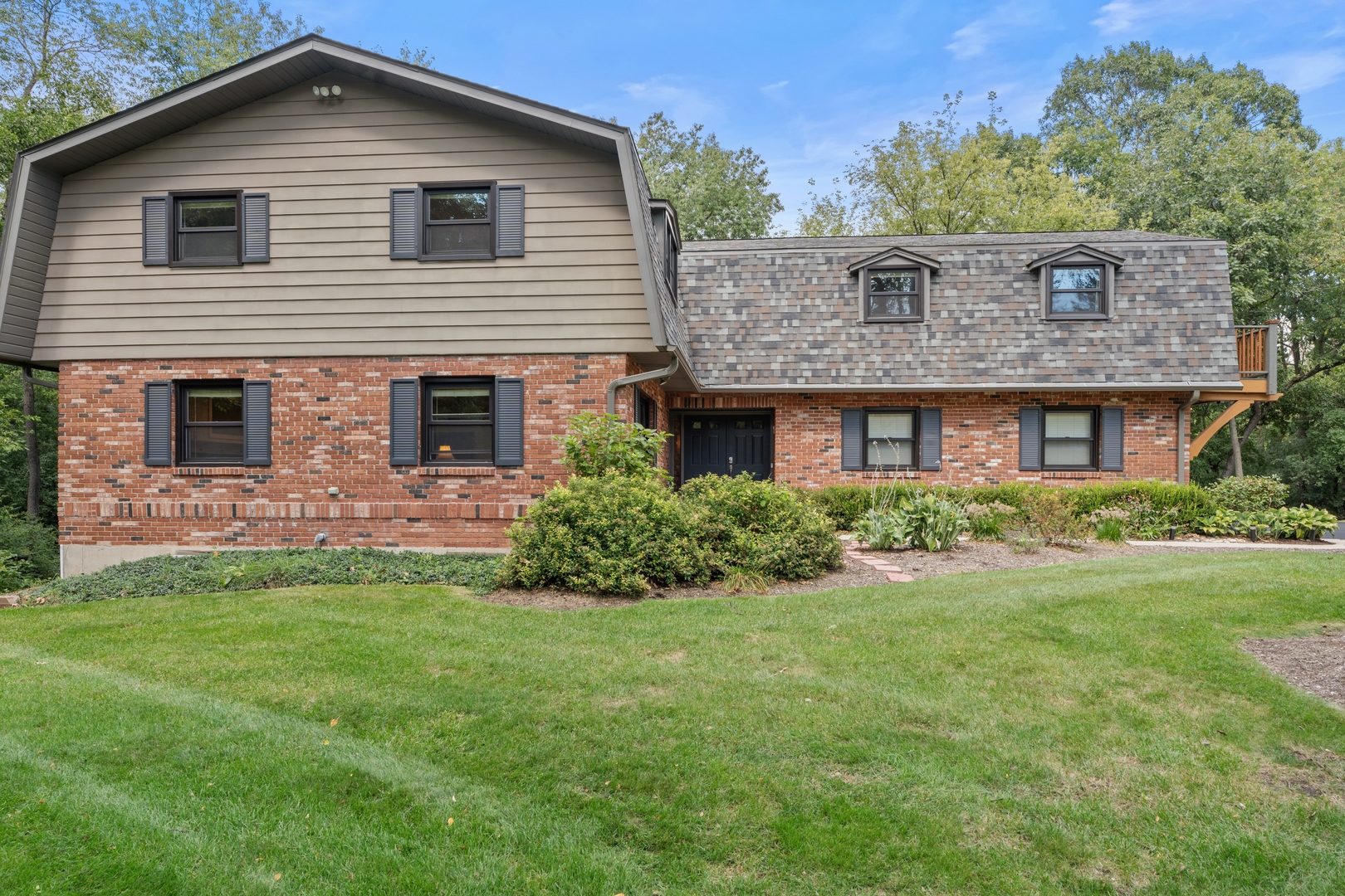 906 Bridle Lane Cary, IL 60013 - Photo 2 of 61 a front view of a house with a yard