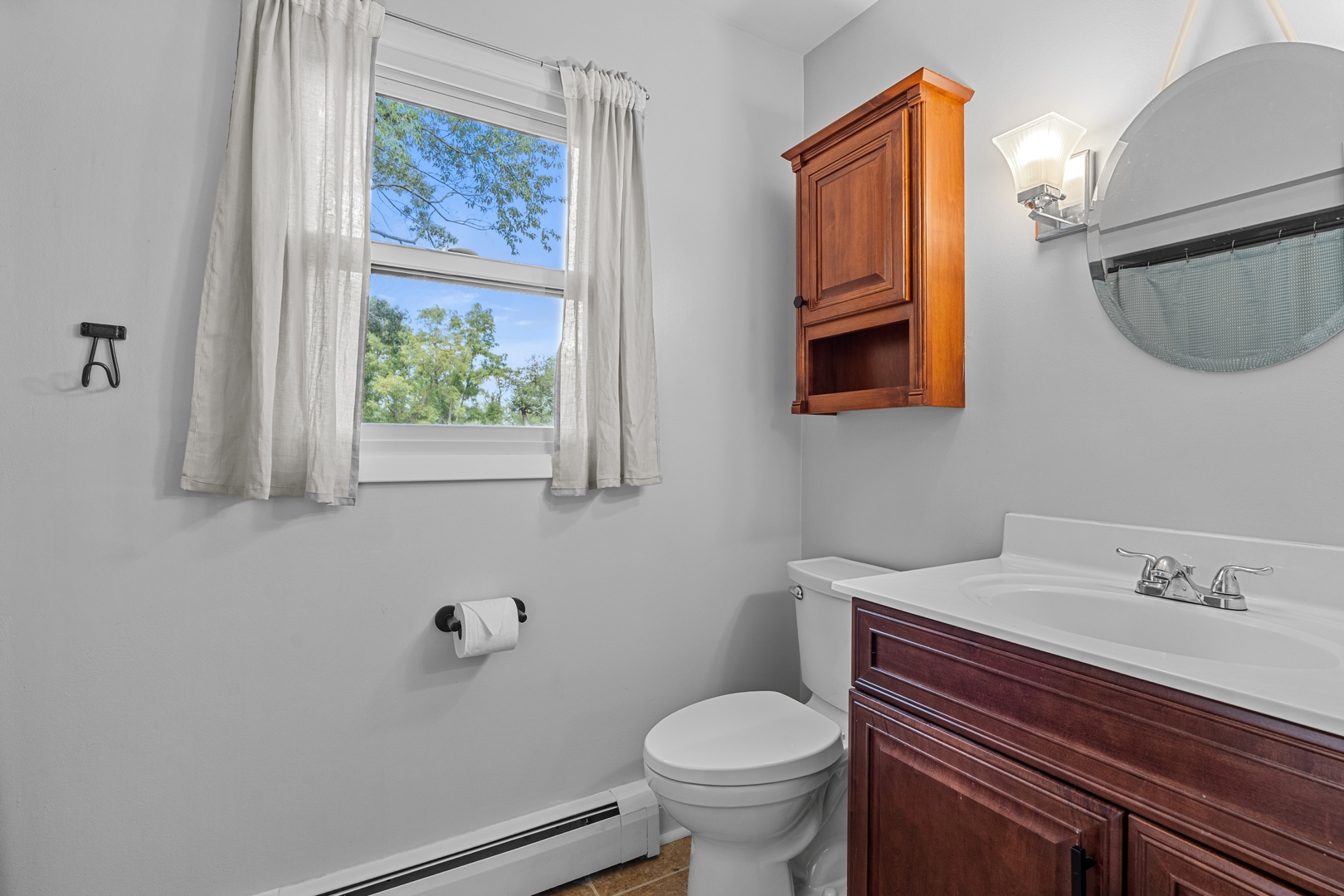 906 Bridle Lane Cary, IL 60013 - Photo 30 of 61 a bathroom with a sink and a mirror