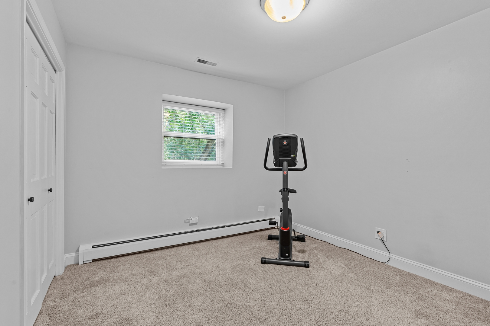 906 Bridle Lane Cary, IL 60013 - Photo 31 of 61 a view of a room with a window and a ceiling fan