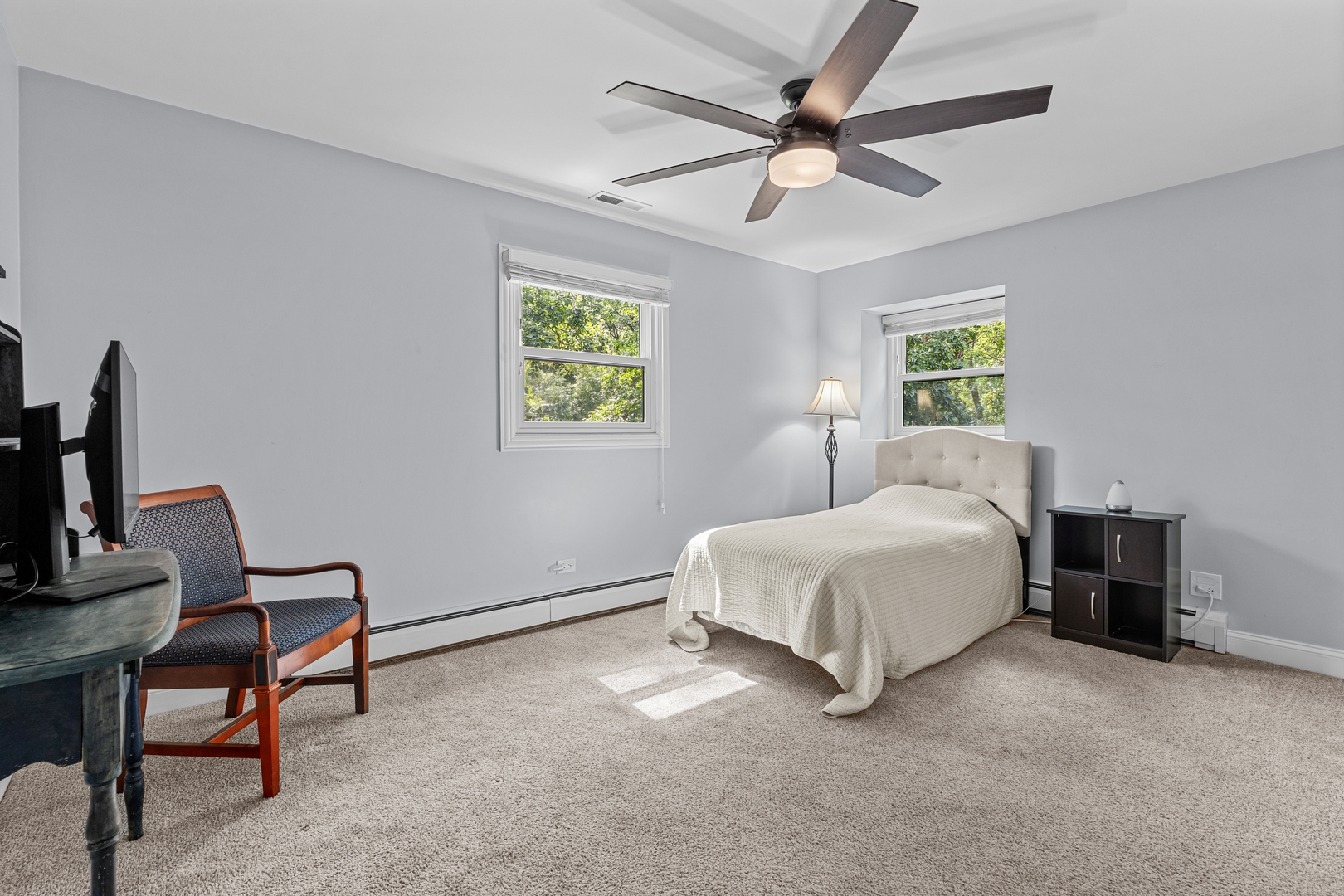 906 Bridle Lane Cary, IL 60013 - Photo 33 of 61 a bed room with a bed and a chandelier
