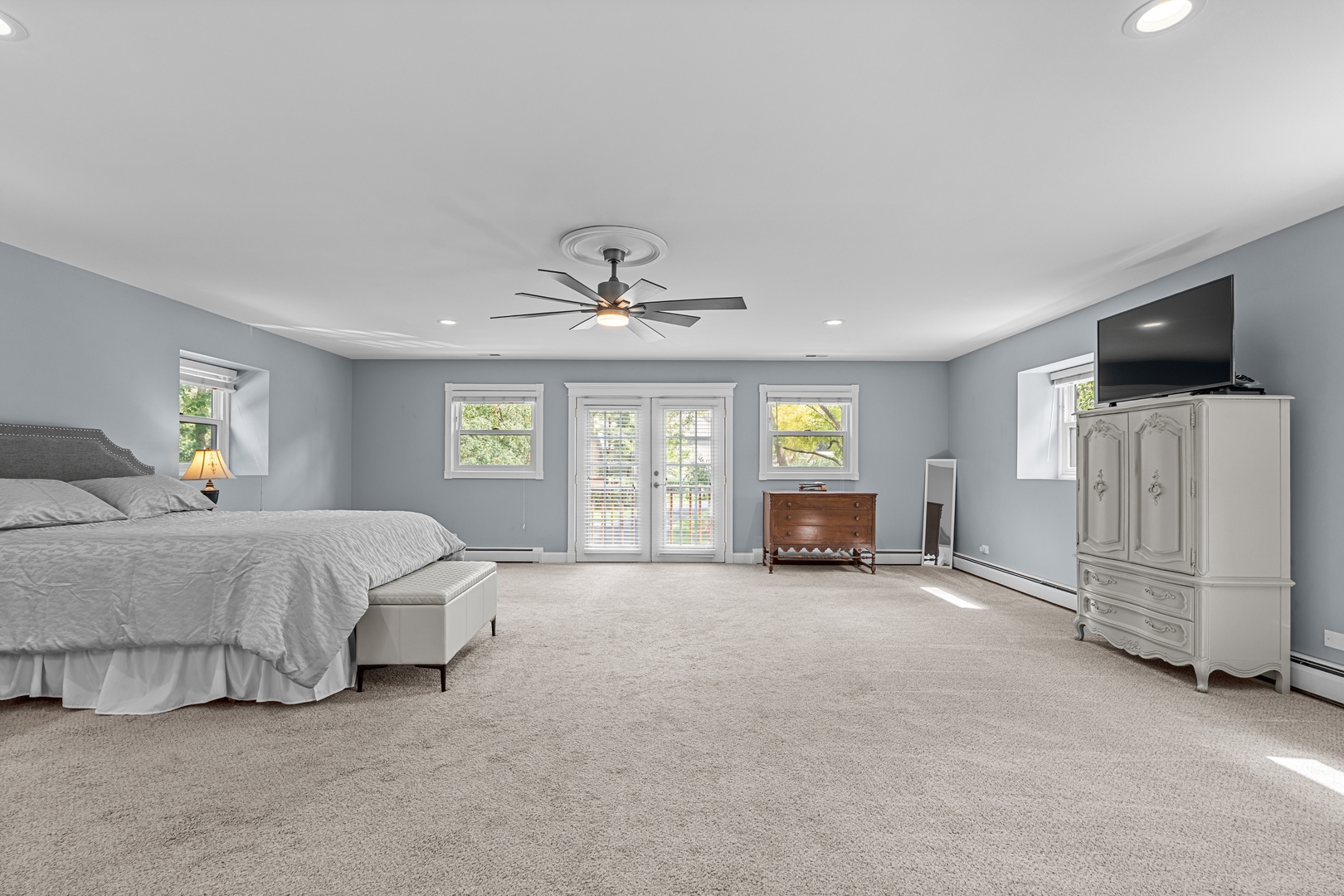 906 Bridle Lane Cary, IL 60013 - Photo 37 of 61 a spacious bedroom with a bed and a television in it