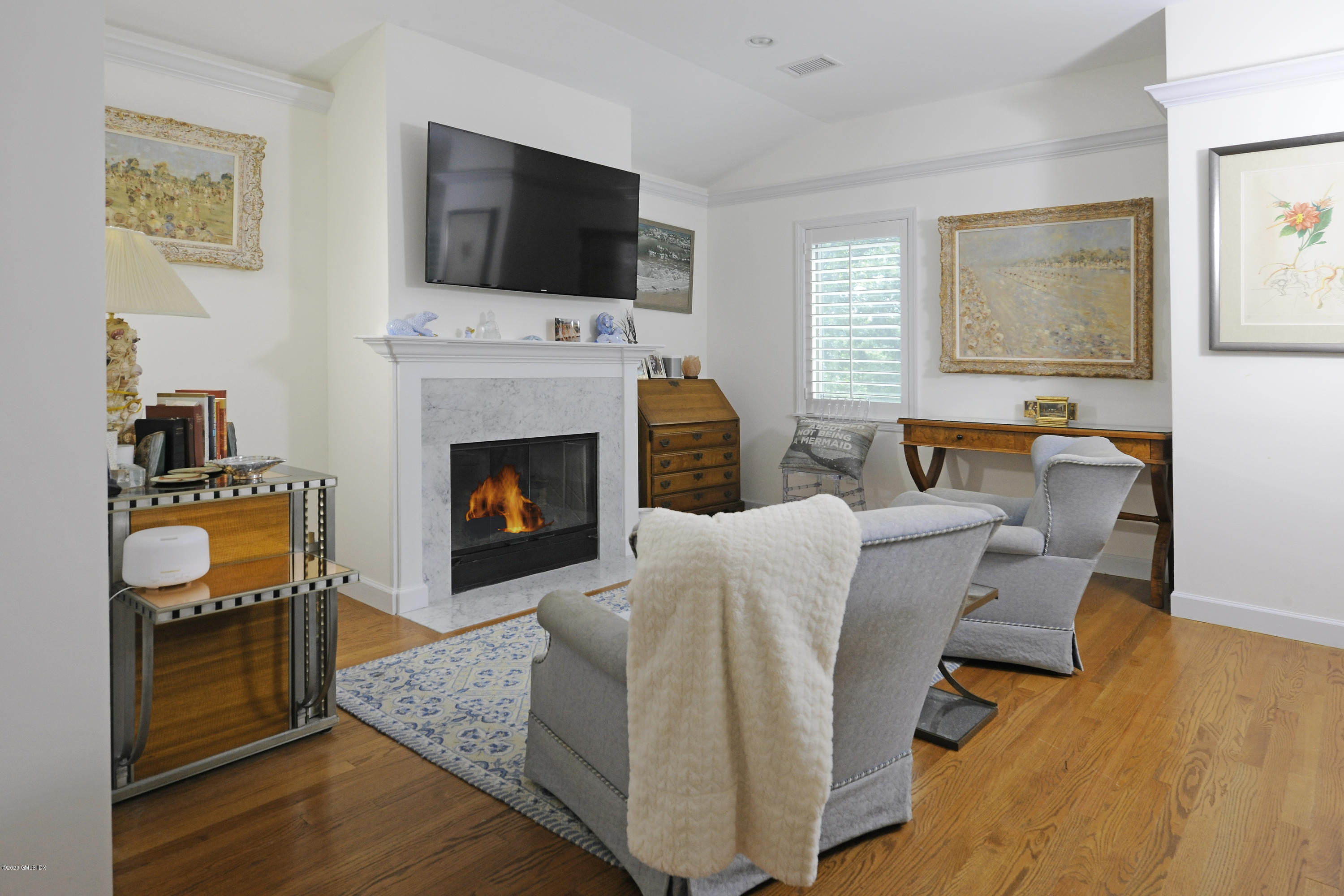 19 Gregory Road Cos Cob, CT 06807 - Photo 12 of 22 a living room with furniture and a fireplace
