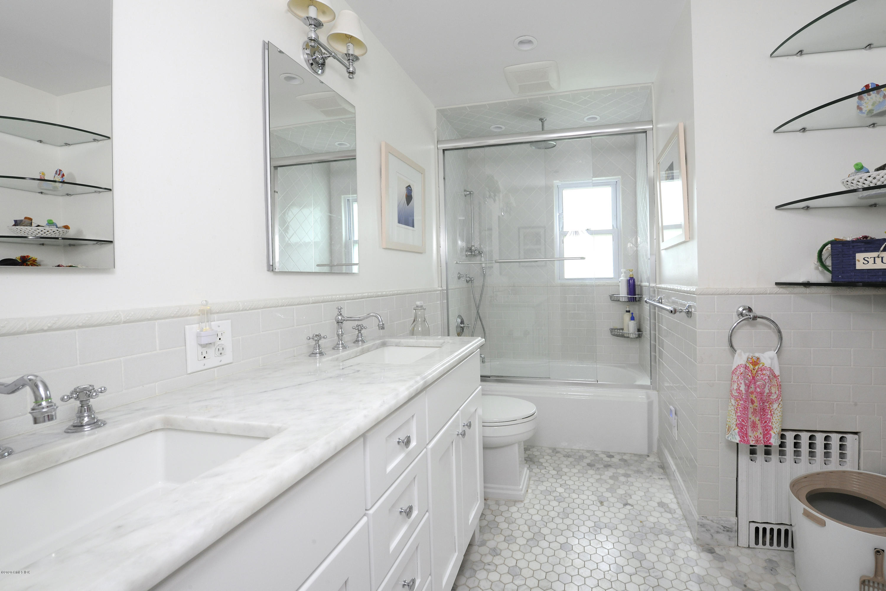 19 Gregory Road Cos Cob, CT 06807 - Photo 21 of 22 a bathroom with a granite countertop sink mirror vanity bathtub and a toilet