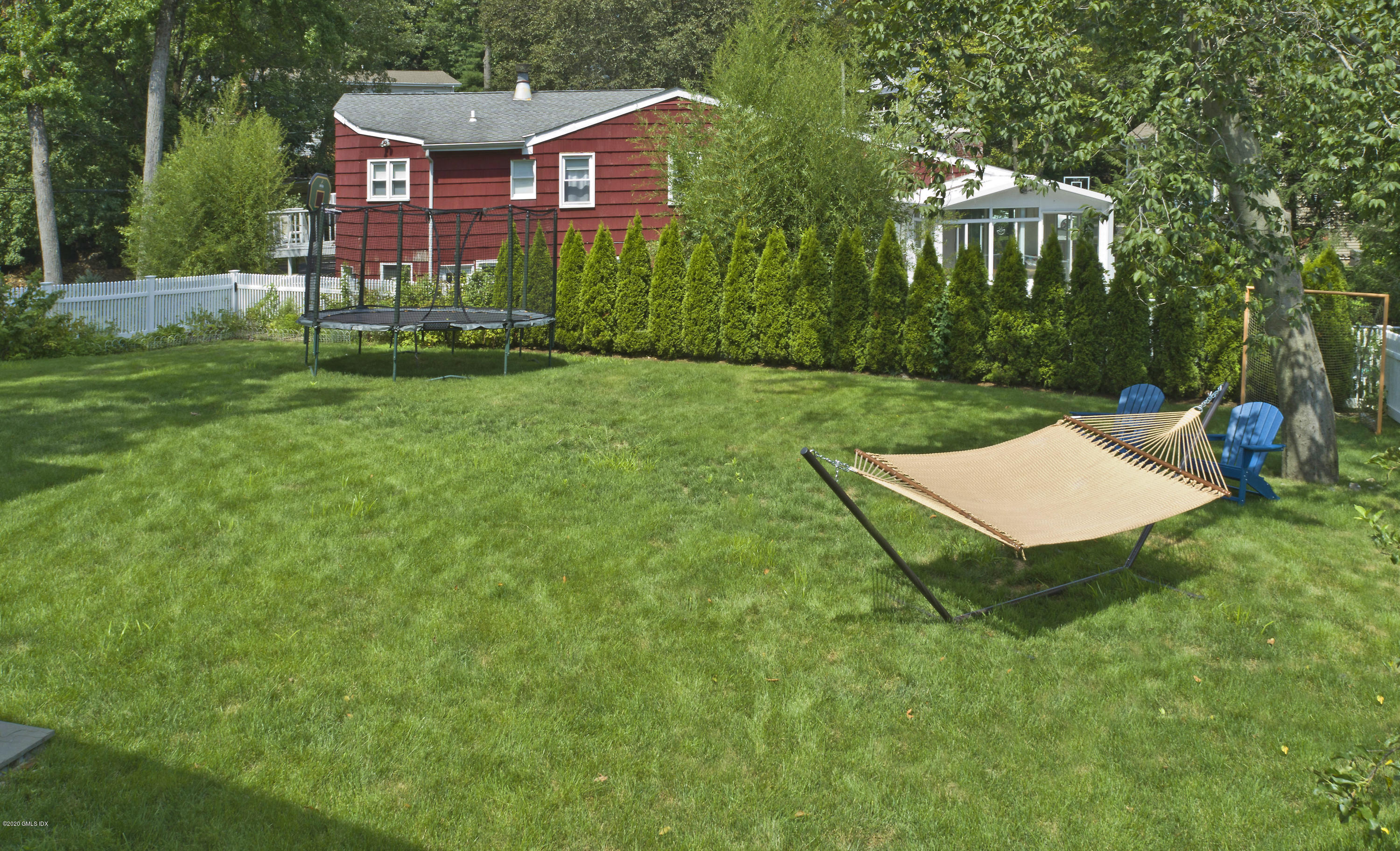 19 Gregory Road Cos Cob, CT 06807 - Photo 4 of 22 a view of a house with a yard and sitting area