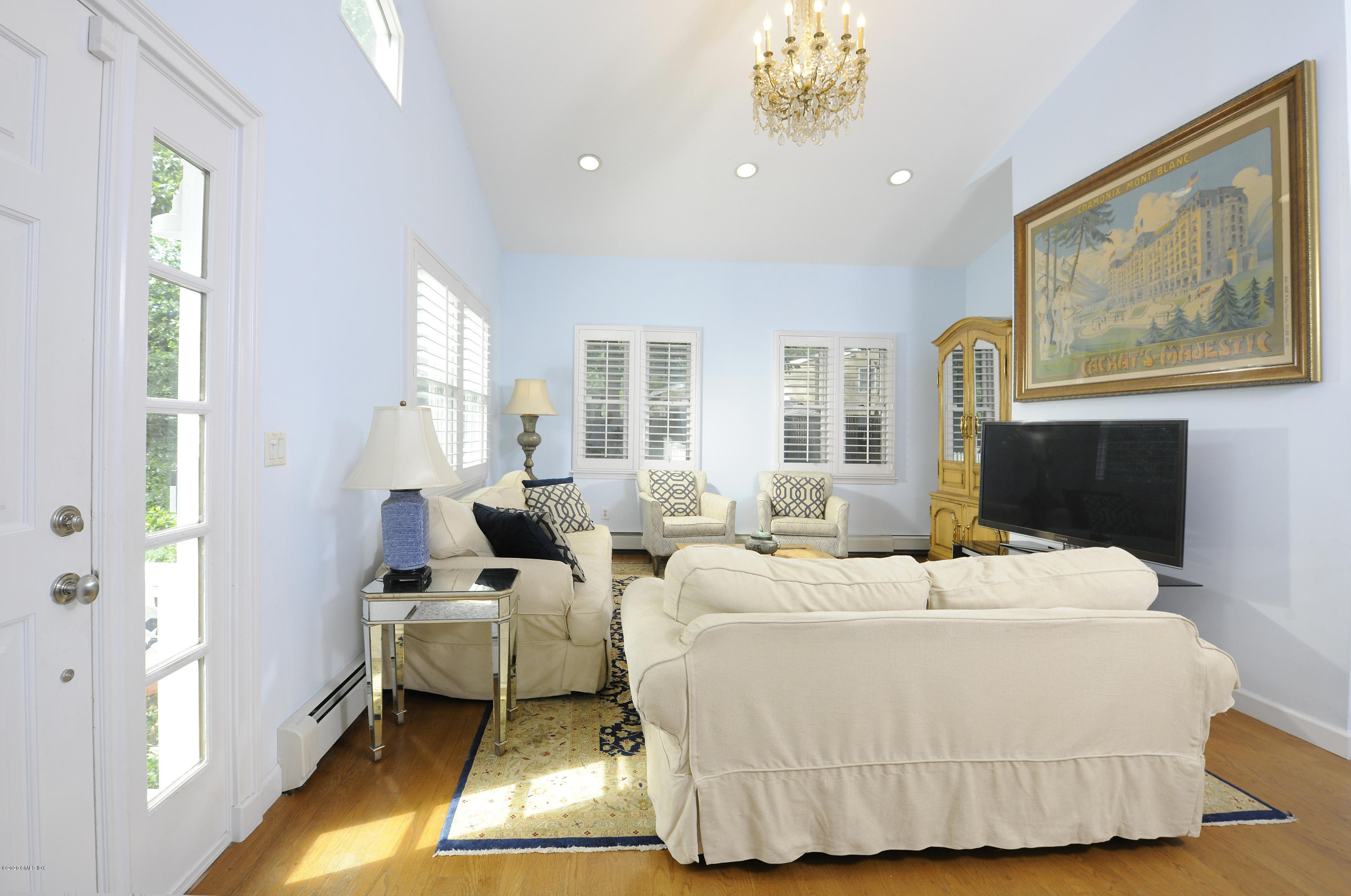 19 Gregory Road Cos Cob, CT 06807 - Photo 6 of 22 a bedroom with a bed and wooden floor