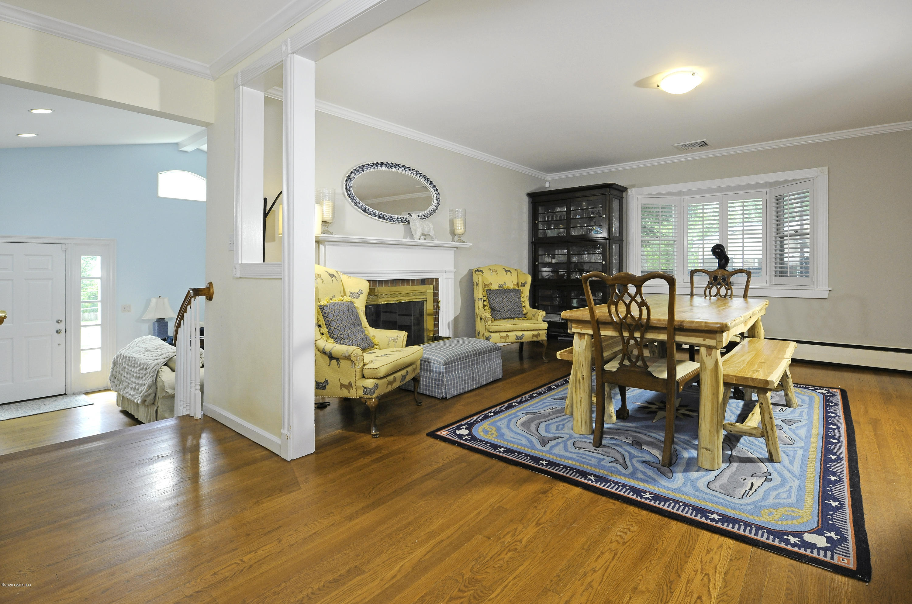 19 Gregory Road Cos Cob, CT 06807 - Photo 7 of 22 a living room with furniture and a fireplace