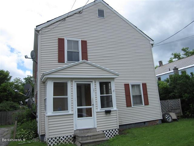 131-135 Protection Avenue North Adams, MA 01247 - Photo 3 of 5 a view of a white house with a white door