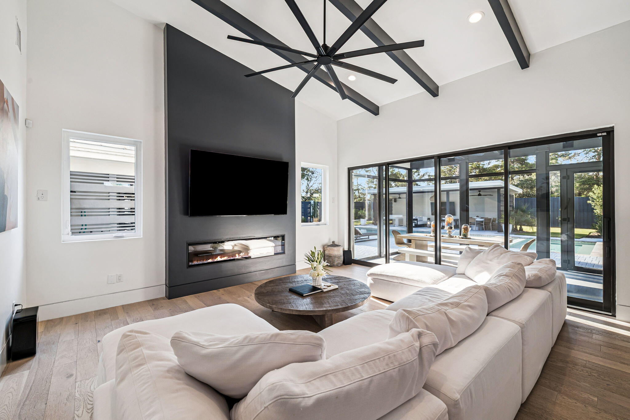 114 Surfside Drive Santa Rosa Beach, FL 32459 - Photo 12 of 45 a living room with furniture and a flat screen tv