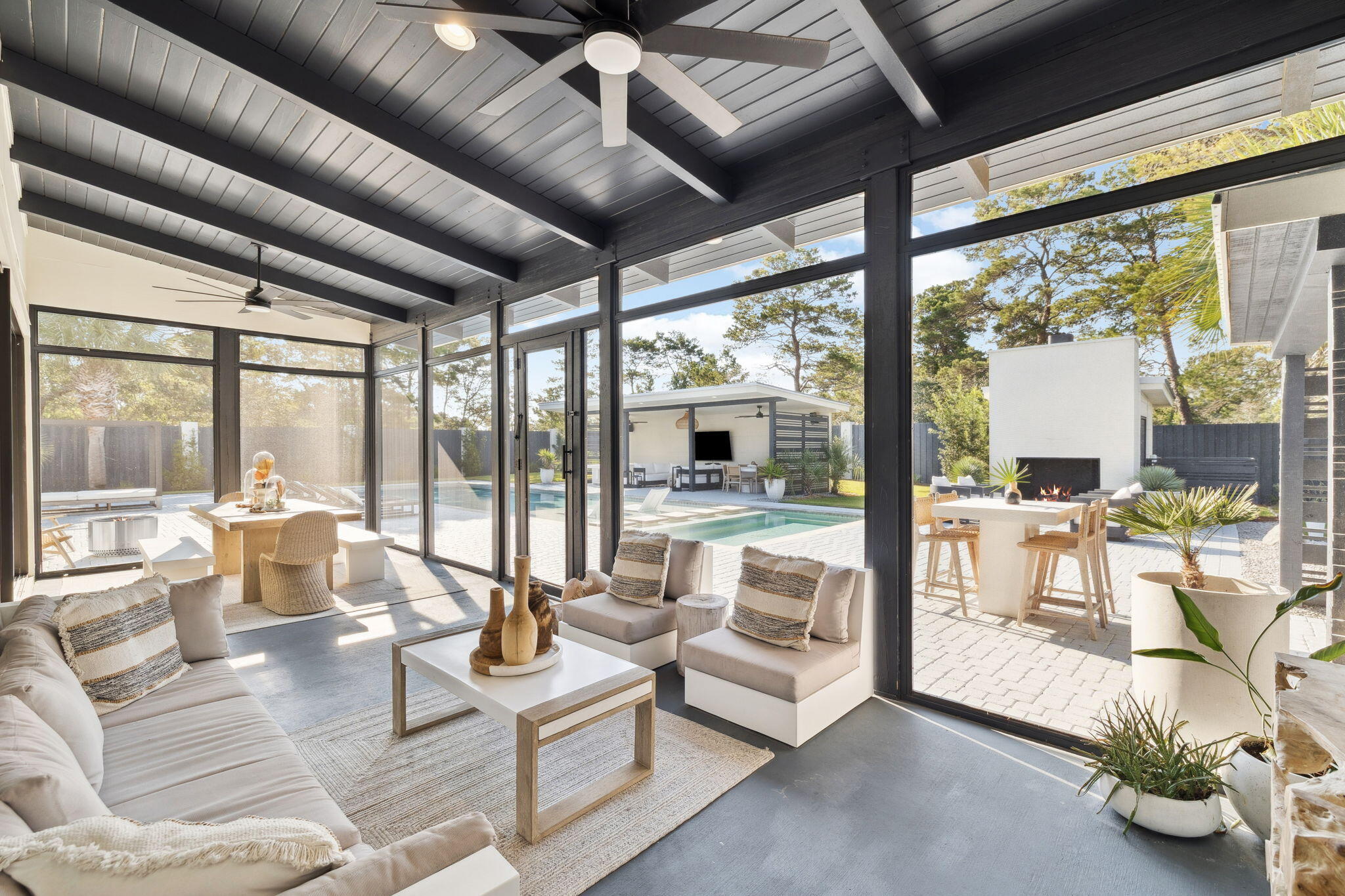 114 Surfside Drive Santa Rosa Beach, FL 32459 - Photo 15 of 45 a living room with fireplace furniture and floor to ceiling windows