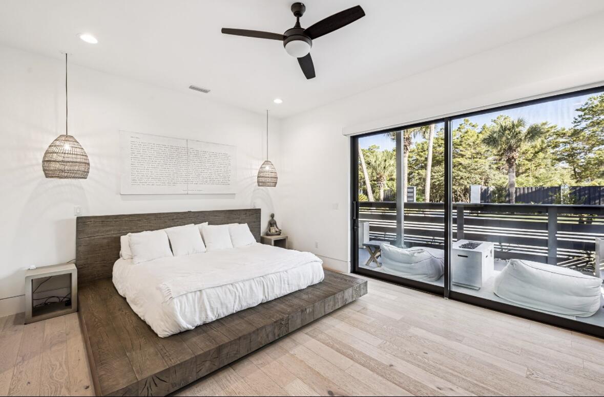 114 Surfside Drive Santa Rosa Beach, FL 32459 - Photo 16 of 45 a bedroom with a large bed and a flat tv screen on dresser