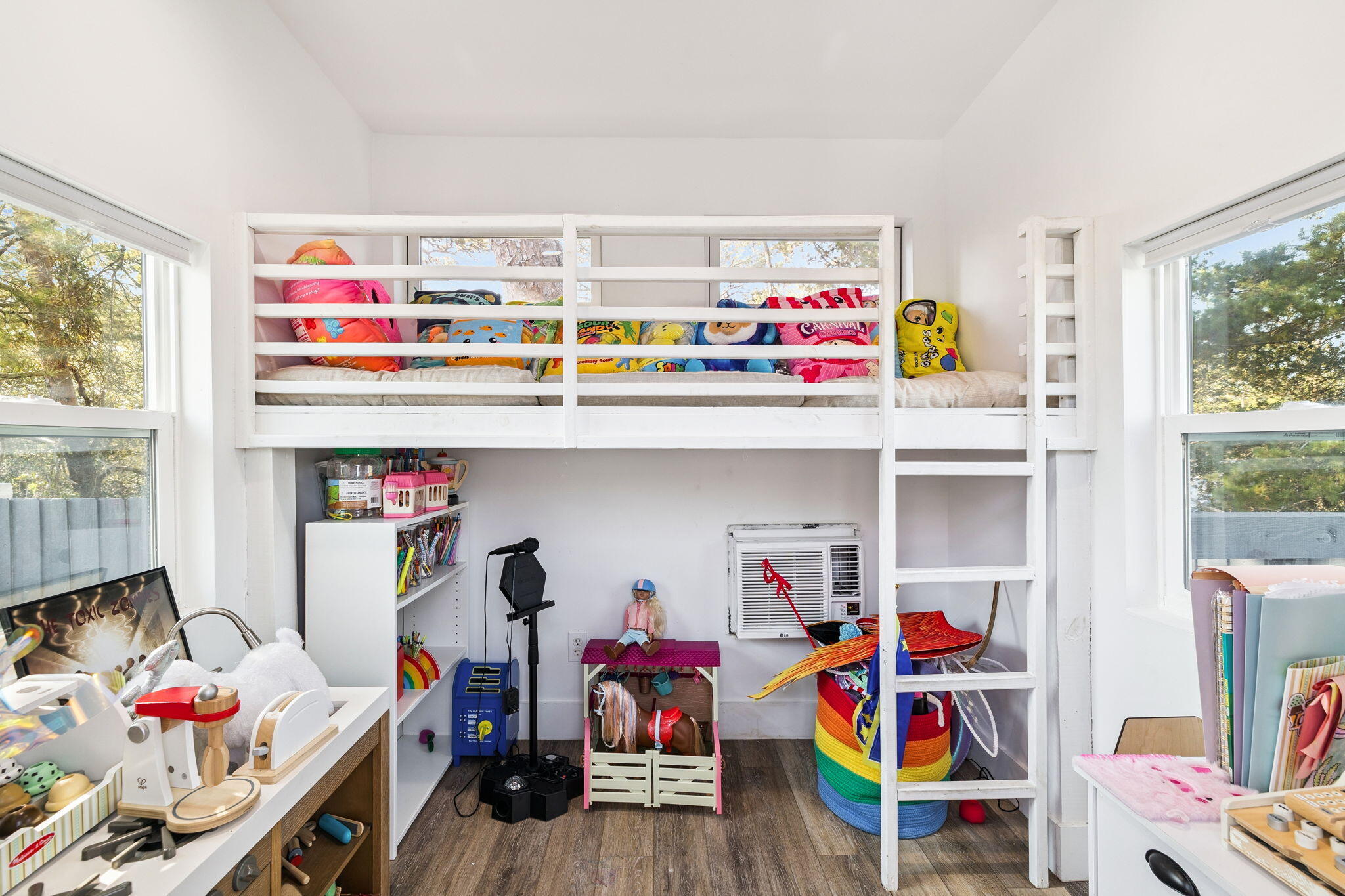 114 Surfside Drive Santa Rosa Beach, FL 32459 - Photo 19 of 45 a utility room with lots of clutter and toys