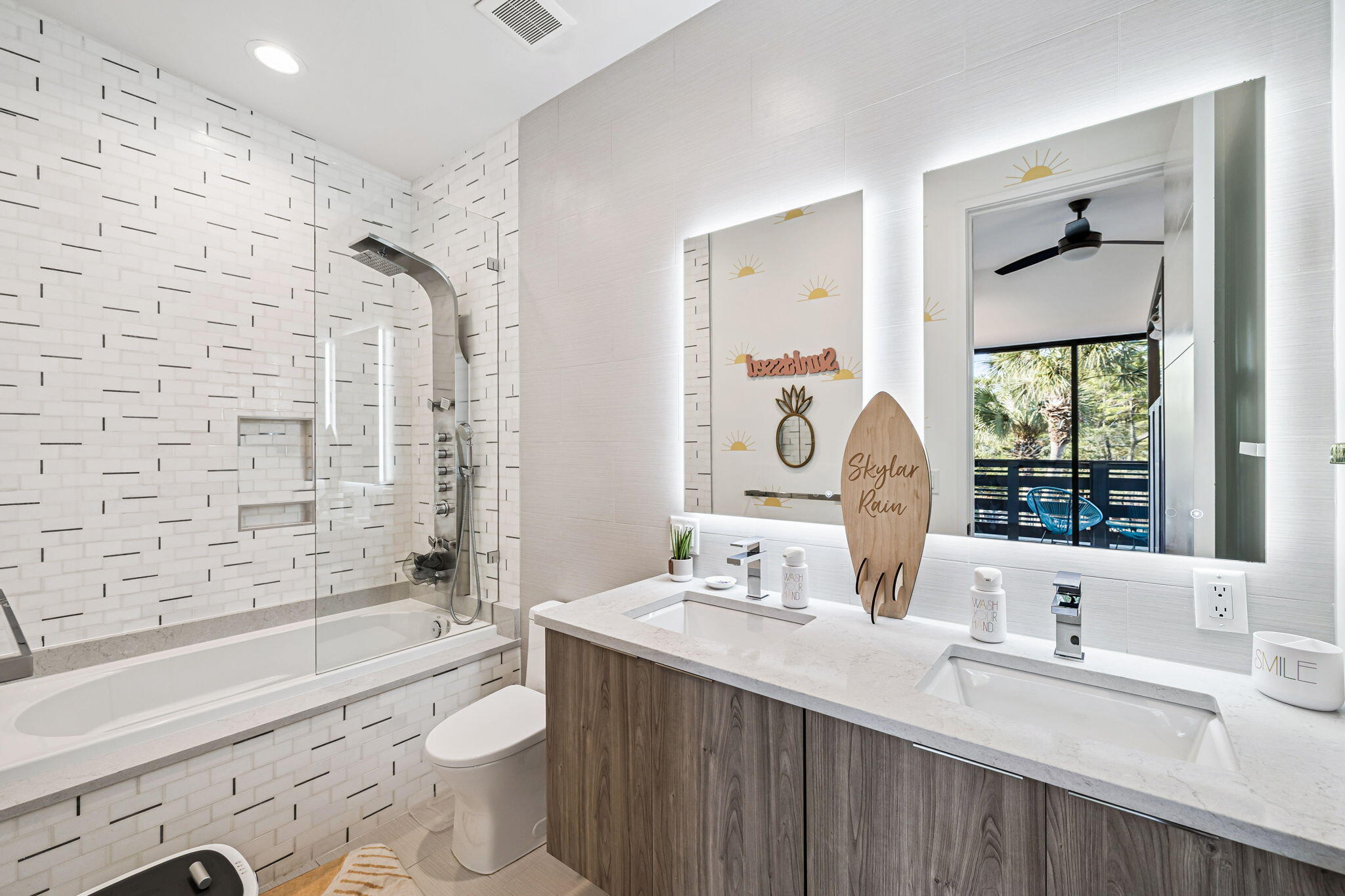 114 Surfside Drive Santa Rosa Beach, FL 32459 - Photo 21 of 45 a bathroom with a double vanity sink toilet mirror and bathtub
