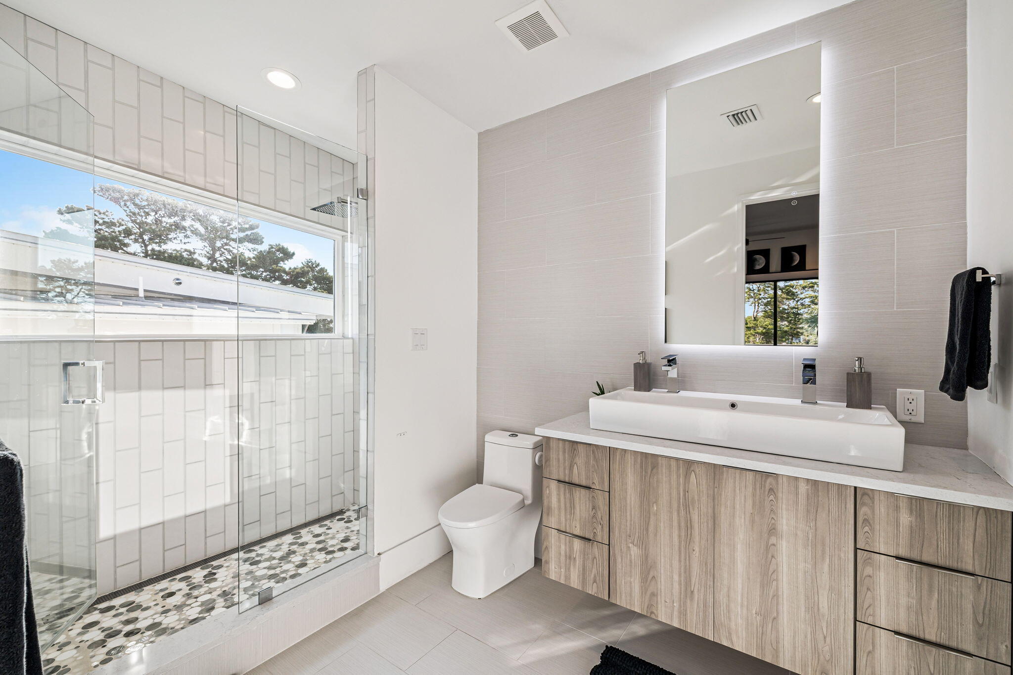 114 Surfside Drive Santa Rosa Beach, FL 32459 - Photo 22 of 45 a bathroom with a double vanity sink mirror and toilet