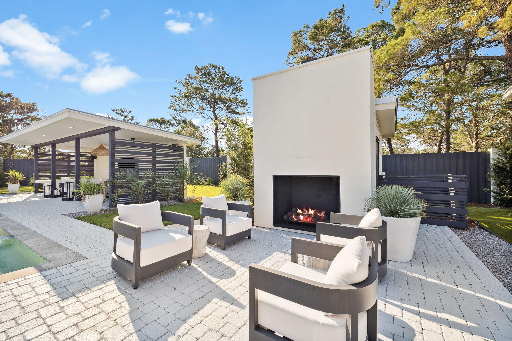 114 Surfside Drive Santa Rosa Beach, FL 32459 - Photo 24 of 45 a view of a patio with couches chairs and a fire pit and a fire pit