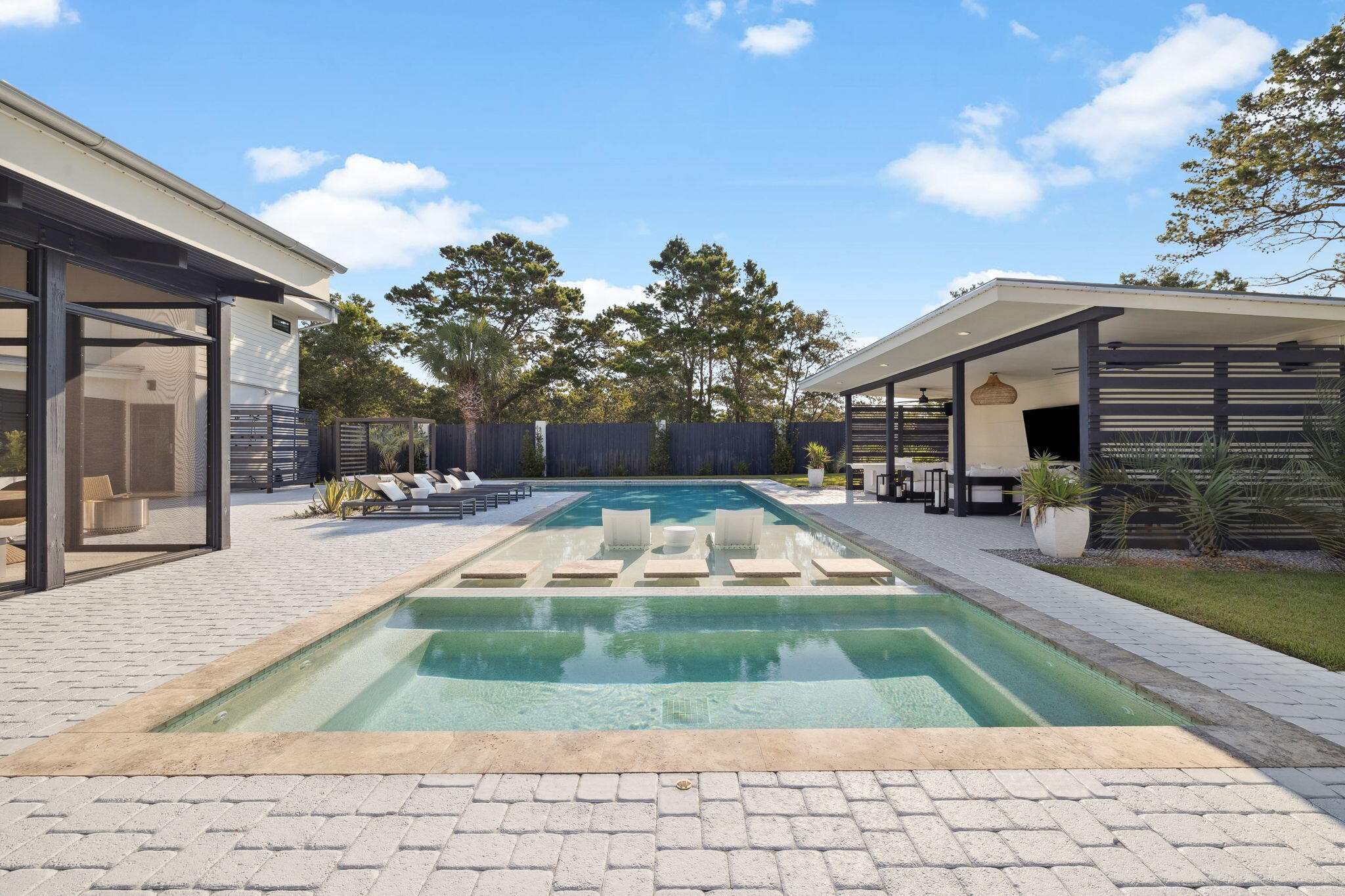 114 Surfside Drive Santa Rosa Beach, FL 32459 - Photo 27 of 45 a view of a house with swimming pool and sitting area