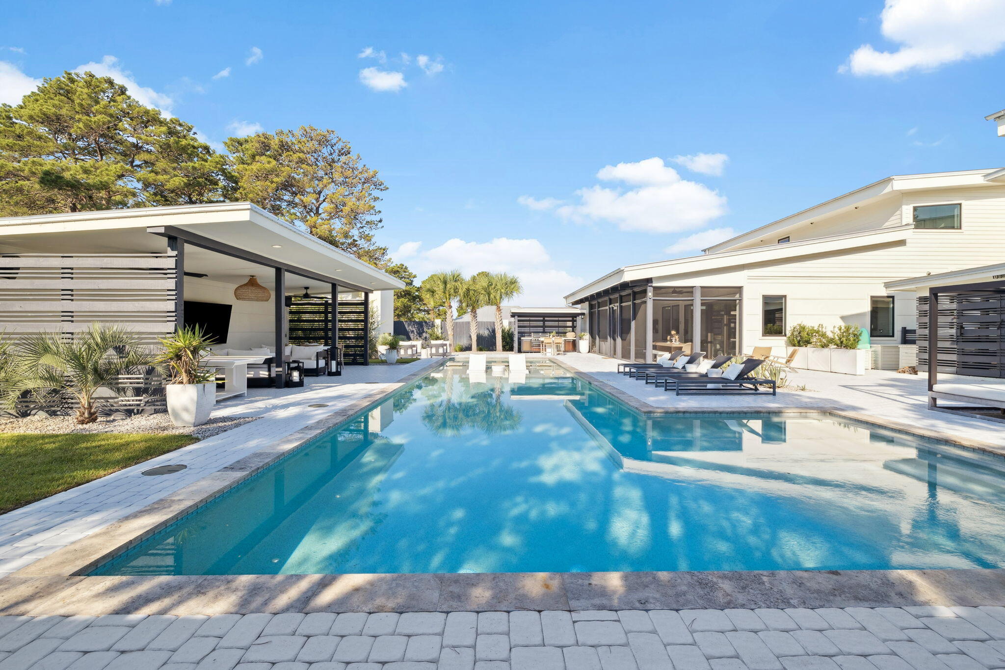 114 Surfside Drive Santa Rosa Beach, FL 32459 - Photo 30 of 45 a view of a patio with table and chairs and potted plants