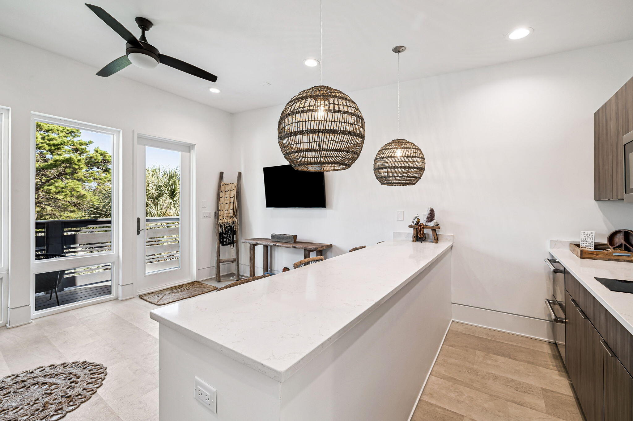 114 Surfside Drive Santa Rosa Beach, FL 32459 - Photo 37 of 45 a room with a table chairs and a flat screen tv