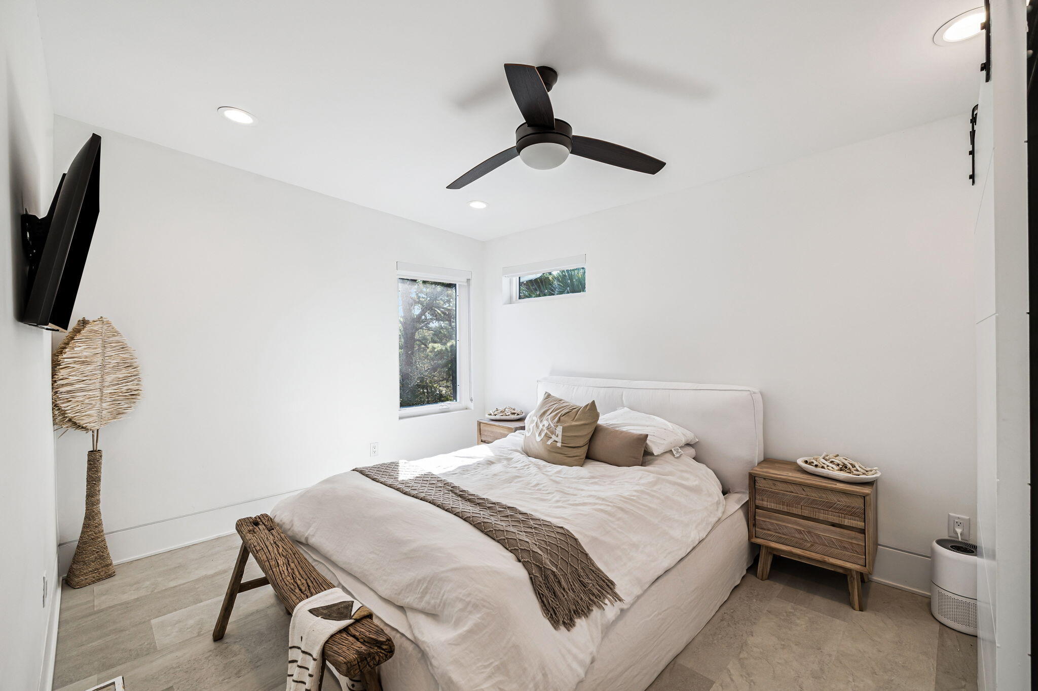 114 Surfside Drive Santa Rosa Beach, FL 32459 - Photo 39 of 45 a bedroom with a bed a chandelier and a window