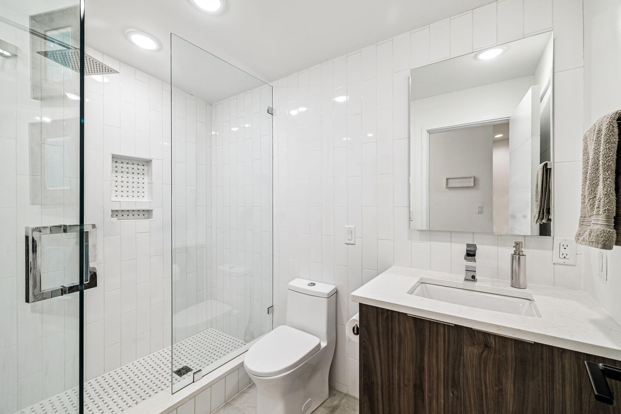 114 Surfside Drive Santa Rosa Beach, FL 32459 - Photo 40 of 45 a bathroom with a shower sink vanity mirror and toilet