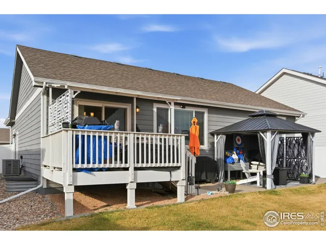 a view of a patio with a table and chairs