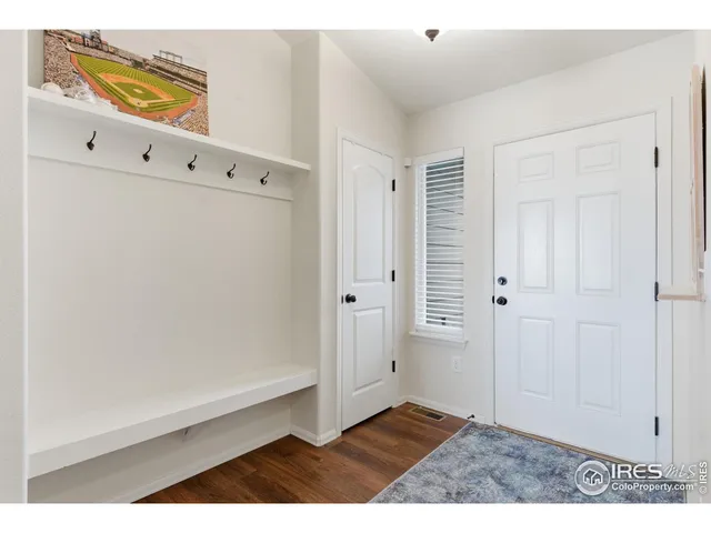 a view of an entryway with wooden floor