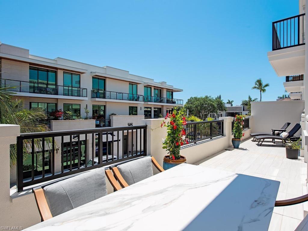 490 5th Street South, Unit 101 Naples, FL 34102 - Photo 23 of 34 a view of swimming pool with seating area