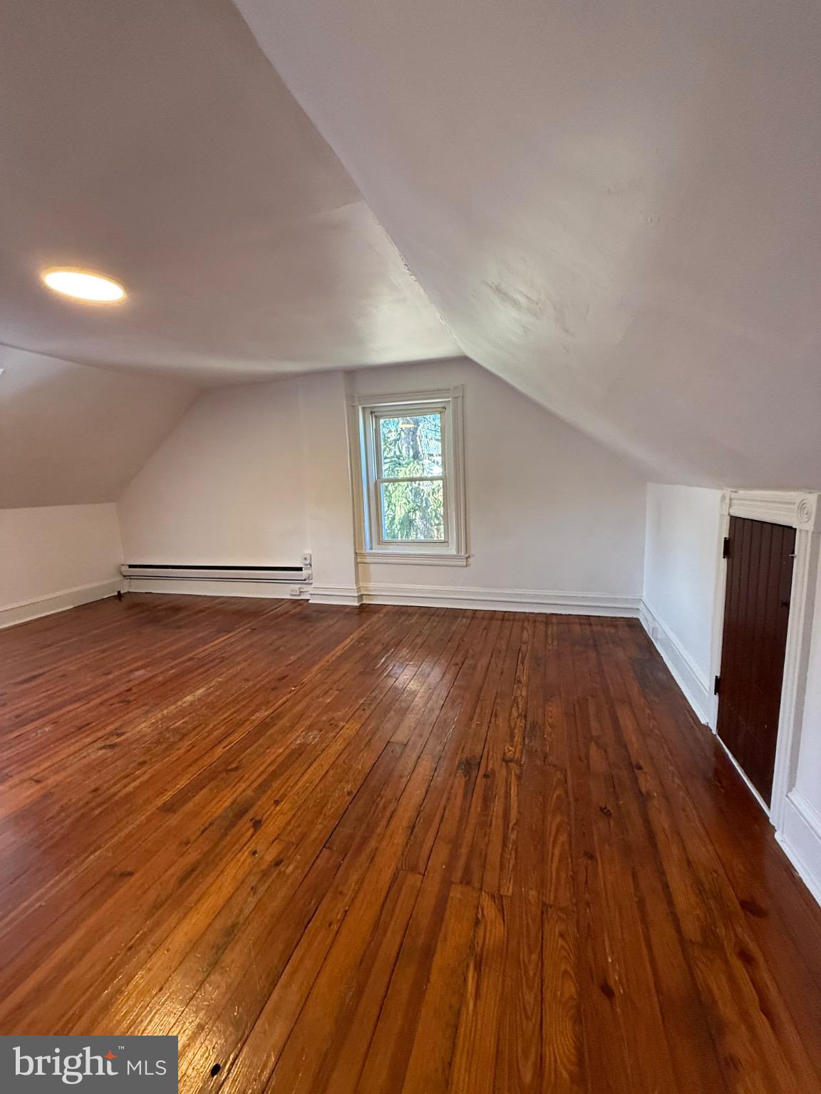 33 East 4th Street Pottstown, PA 19464 - Photo 17 of 20 an empty room with wooden floor and windows
