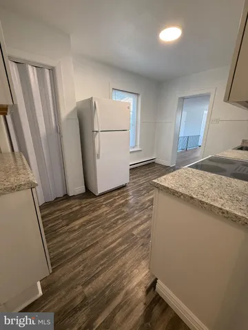 a view of a storage & utility room with a sink