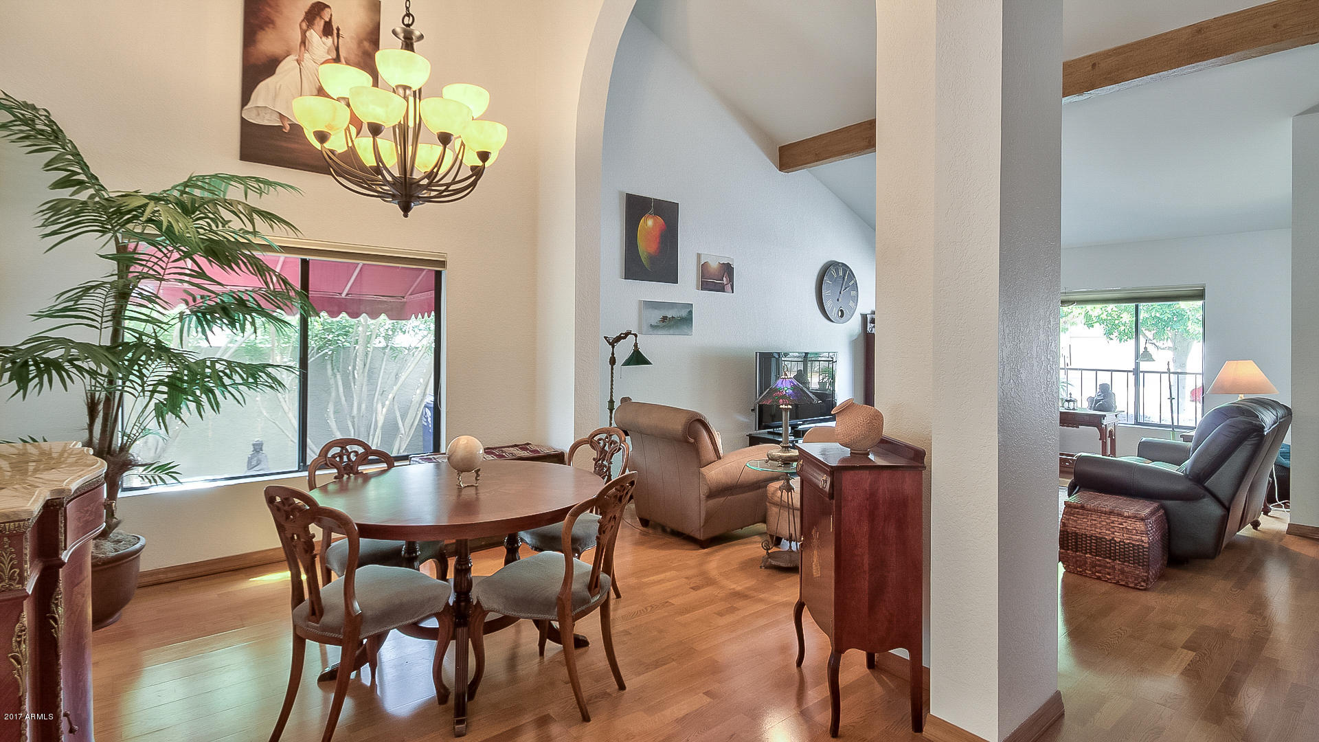 5521 South Rocky Point Road Tempe, AZ 85283 - Photo 10 of 38 a dining room with furniture and a chandelier