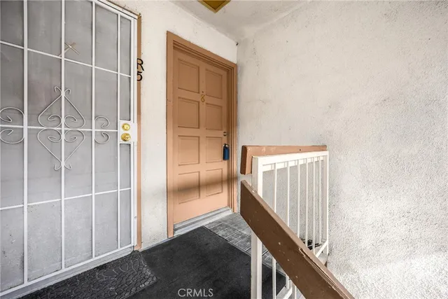 a front view of a house with plants