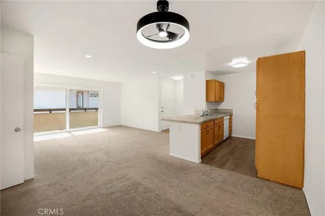 a kitchen with a sink cabinets and window