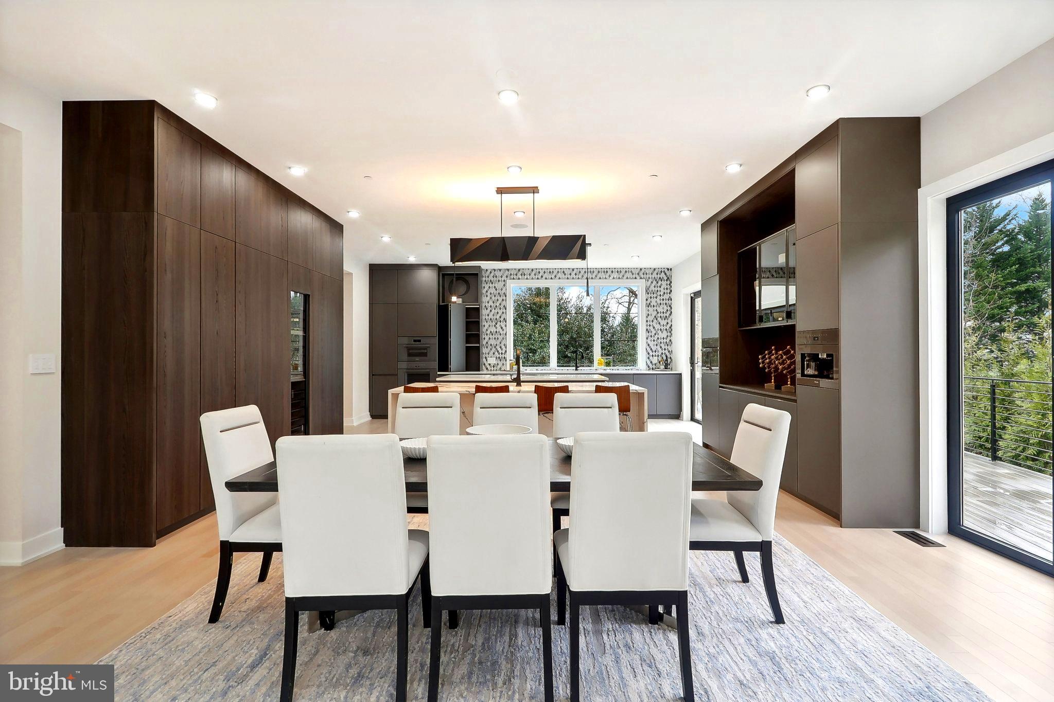 4920 Loughboro Road Northwest Washington, DC 20016 - Photo 4 of 41 a view of a dining room with furniture window and wooden floor