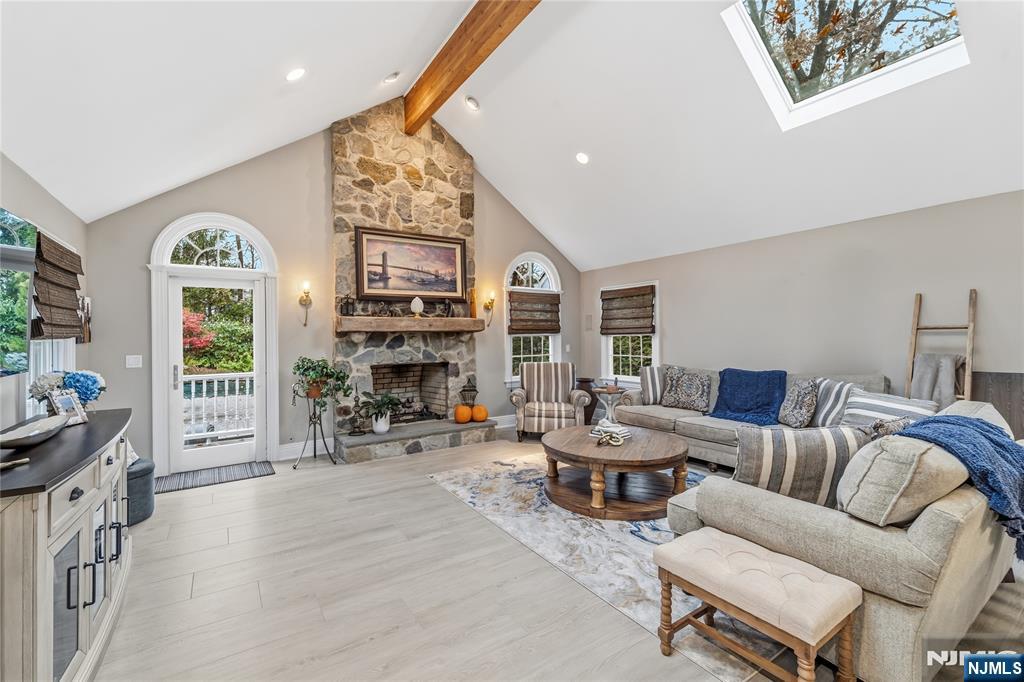 854 Cambridge Road River Vale, NJ 07675 - Photo 17 of 50 a living room with furniture a fireplace and a flat screen tv