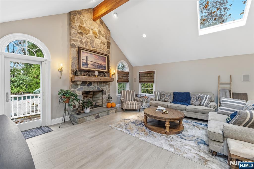 854 Cambridge Road River Vale, NJ 07675 - Photo 18 of 50 a living room with furniture fireplace and a large window