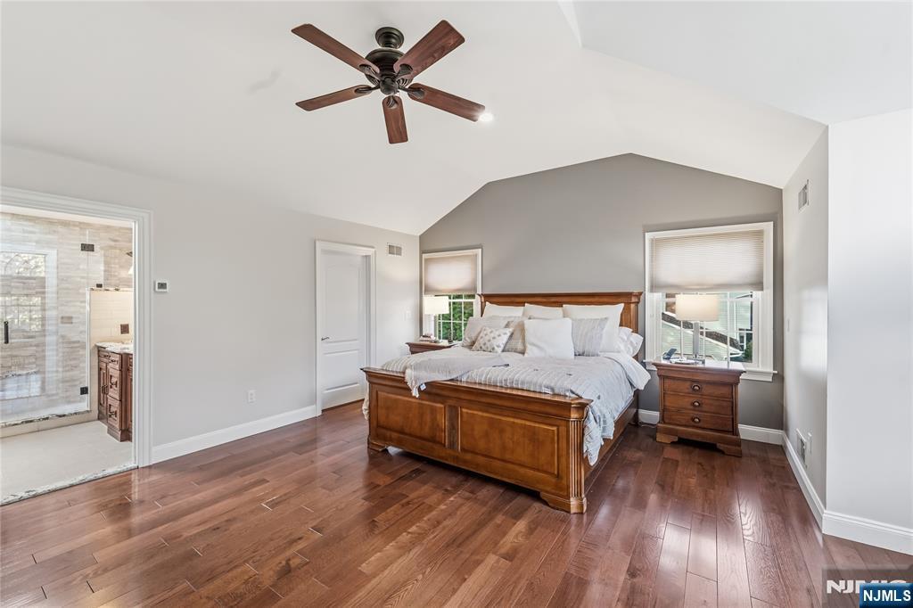 854 Cambridge Road River Vale, NJ 07675 - Photo 30 of 50 a bedroom with a large bed and a chandelier