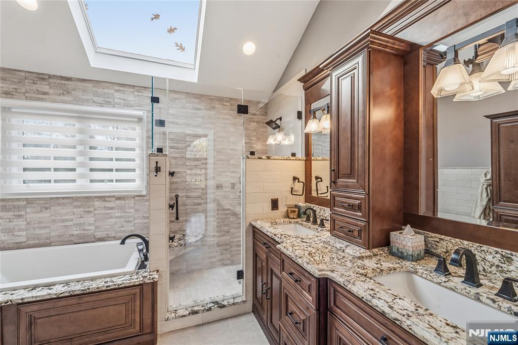 854 Cambridge Road River Vale, NJ 07675 - Photo 31 of 50 a bathroom with a granite countertop double vanity sink mirror and shower