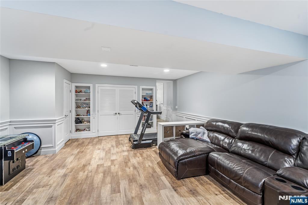 854 Cambridge Road River Vale, NJ 07675 - Photo 37 of 50 a living room with a couch and a dresser with wooden floor