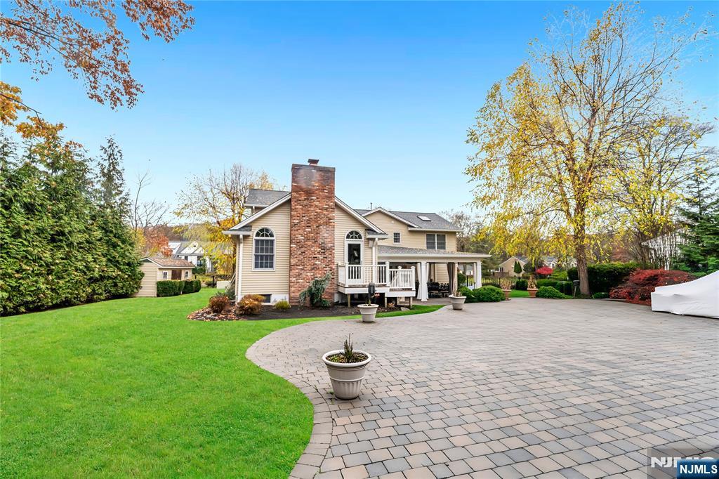 854 Cambridge Road River Vale, NJ 07675 - Photo 43 of 50 a front view of a house with a yard
