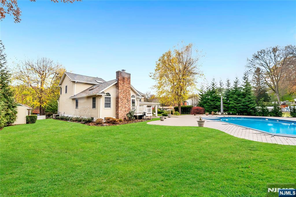854 Cambridge Road River Vale, NJ 07675 - Photo 44 of 50 a view of a house with a big yard and sitting area