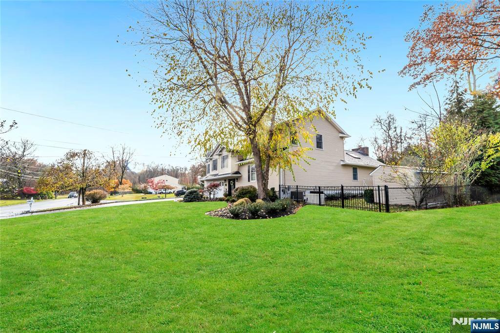 854 Cambridge Road River Vale, NJ 07675 - Photo 47 of 50 a view of a house with a big yard and sitting area