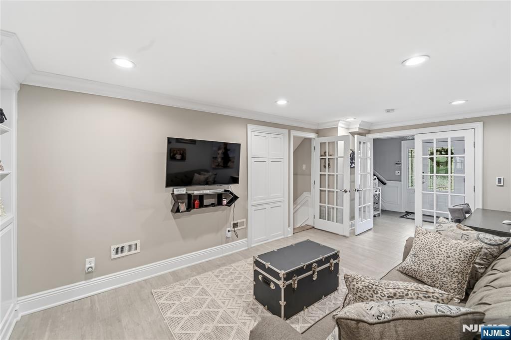 854 Cambridge Road River Vale, NJ 07675 - Photo 5 of 50 a living room with furniture a flat screen tv and large window